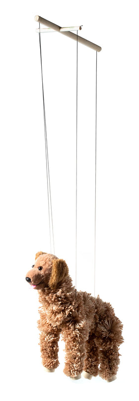 Artisan Owl marionette in hand demonstrates puppeteering gestures.