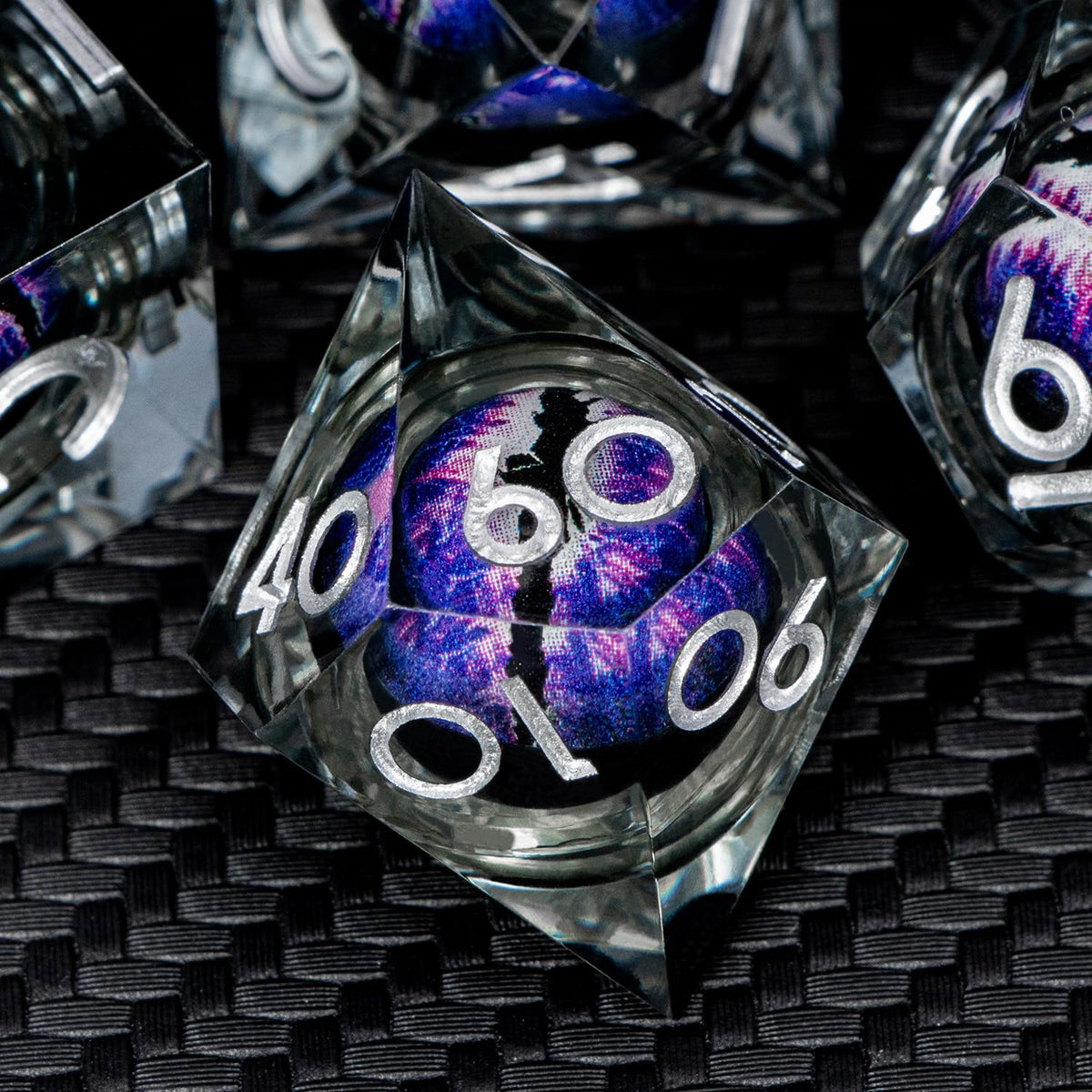 ARUOHHA Polyhedral dice on tabletop during a game session.