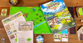 Asmodee Cozy Stickerville catalogue cards reveal town possibilities.