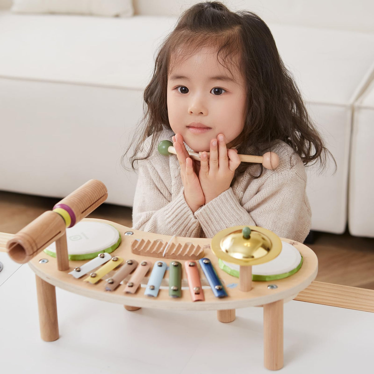 Asweets wooden drum set with cymbal highlights tactile rhythm creation.