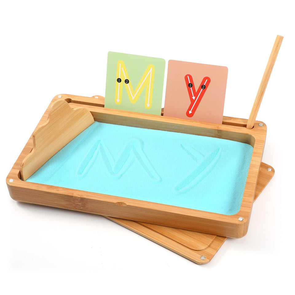 AtMini Montessori sand tray with blue lid enables focused letter tracing.