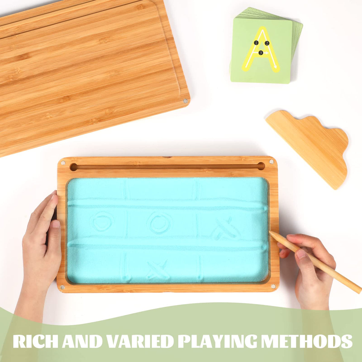 AtMini sand tray with uppercase and lowercase cards for early literacy exploration.