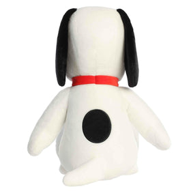 Aurora Jumbo Floppy Snoopy plush on a sofa for playful home decor.