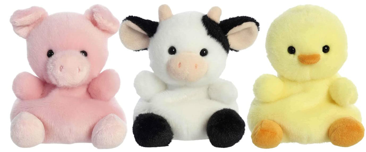 Aurora Palm Pals Sweetie Cow sits in your hand, soft plush for cozy playtime.