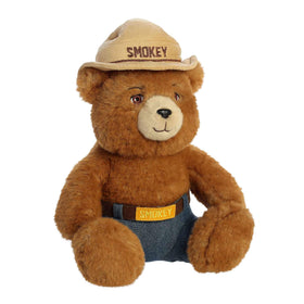 Aurora Smokey Bear plush wearing jeans for classic teddy appeal.