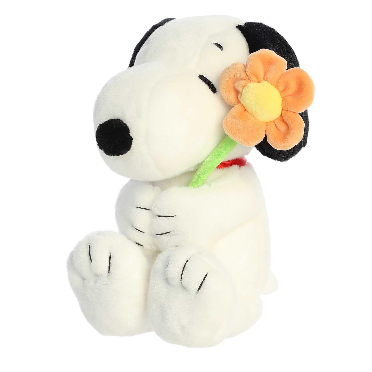Aurora Timeless Peanuts Snoopy plush with flower, front view ready for cuddles.