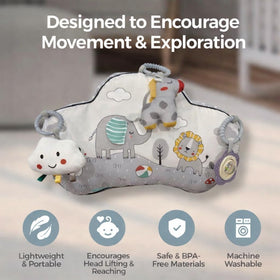 Detachable rattle toy on Autumn Bliss Co pillow promotes auditory exploration