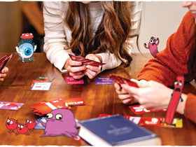 The Awkward Yeti Organ Attack box art features bold, kid-friendly illustrations.