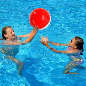 AXBMM kids at a party with red and white cartoon beach balls
