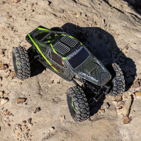 Axial AX24 XC-1 rock slider LED lights illuminate trails.