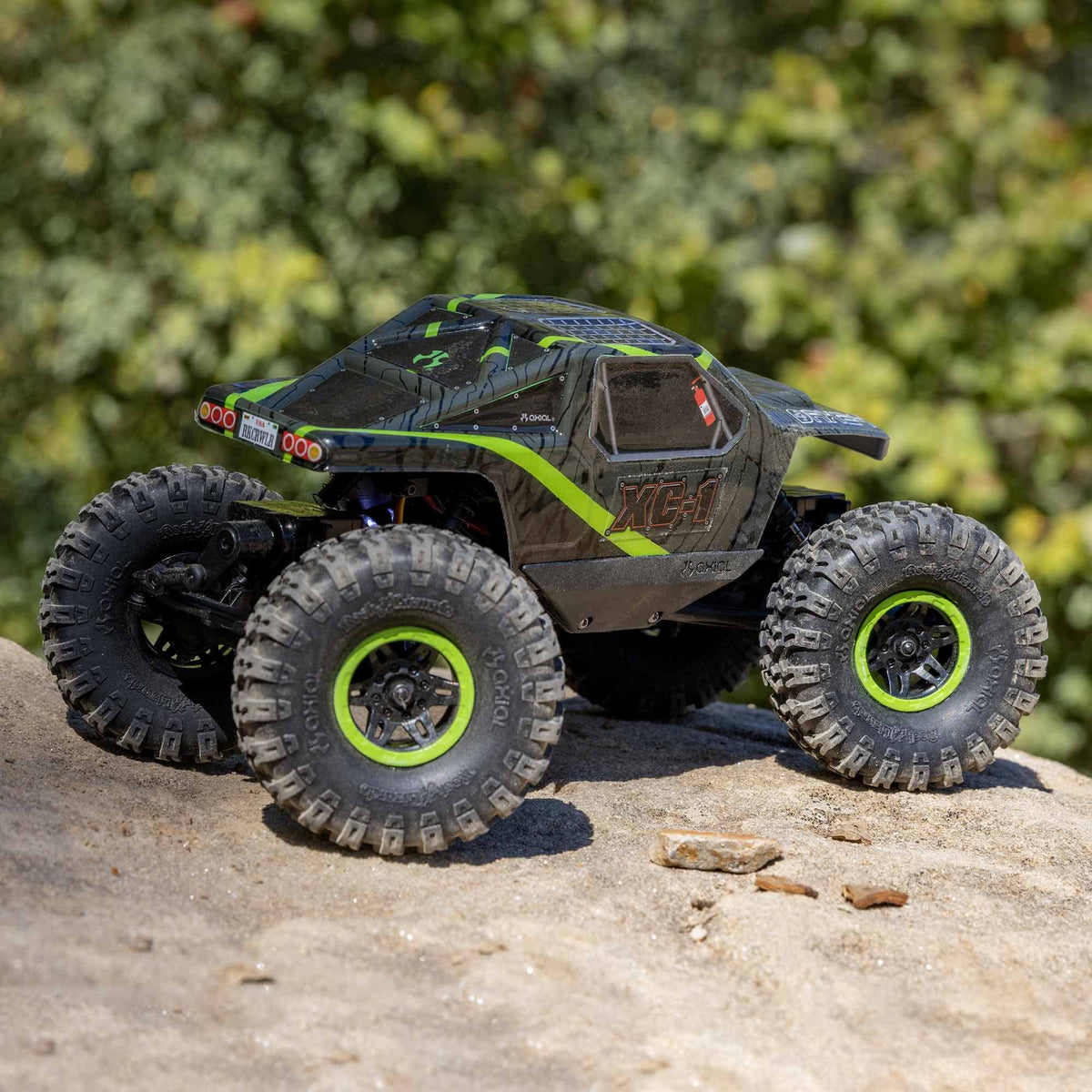 Axial AX24 XC-1 side chassis articulation for rough-terrain handling.