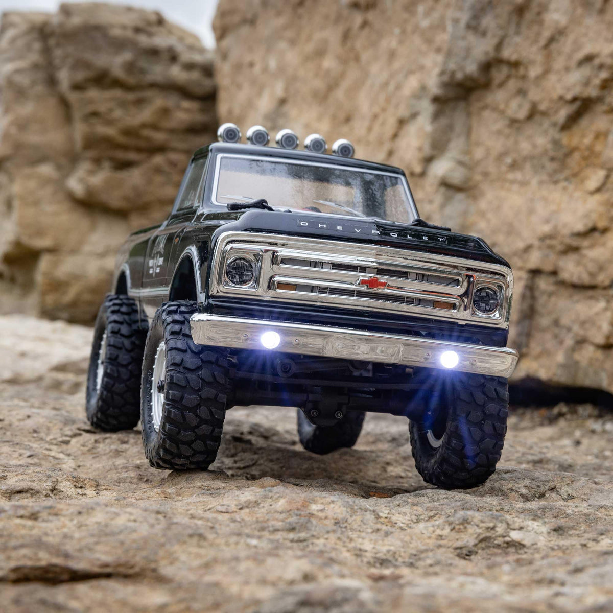 Axial RC Truck 1967 C10 shocks highlighting smooth, responsive suspension on rough terrain.