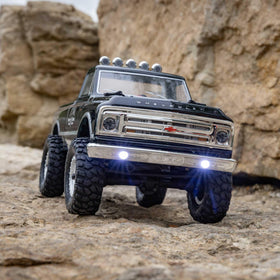 Axial RC Truck 1967 C10 shocks highlighting smooth, responsive suspension on rough terrain.