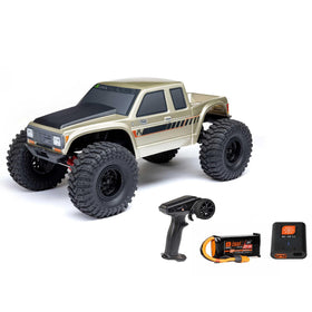 Axial SCX10III Coyote body with bold gold finish for trail-ready presence.