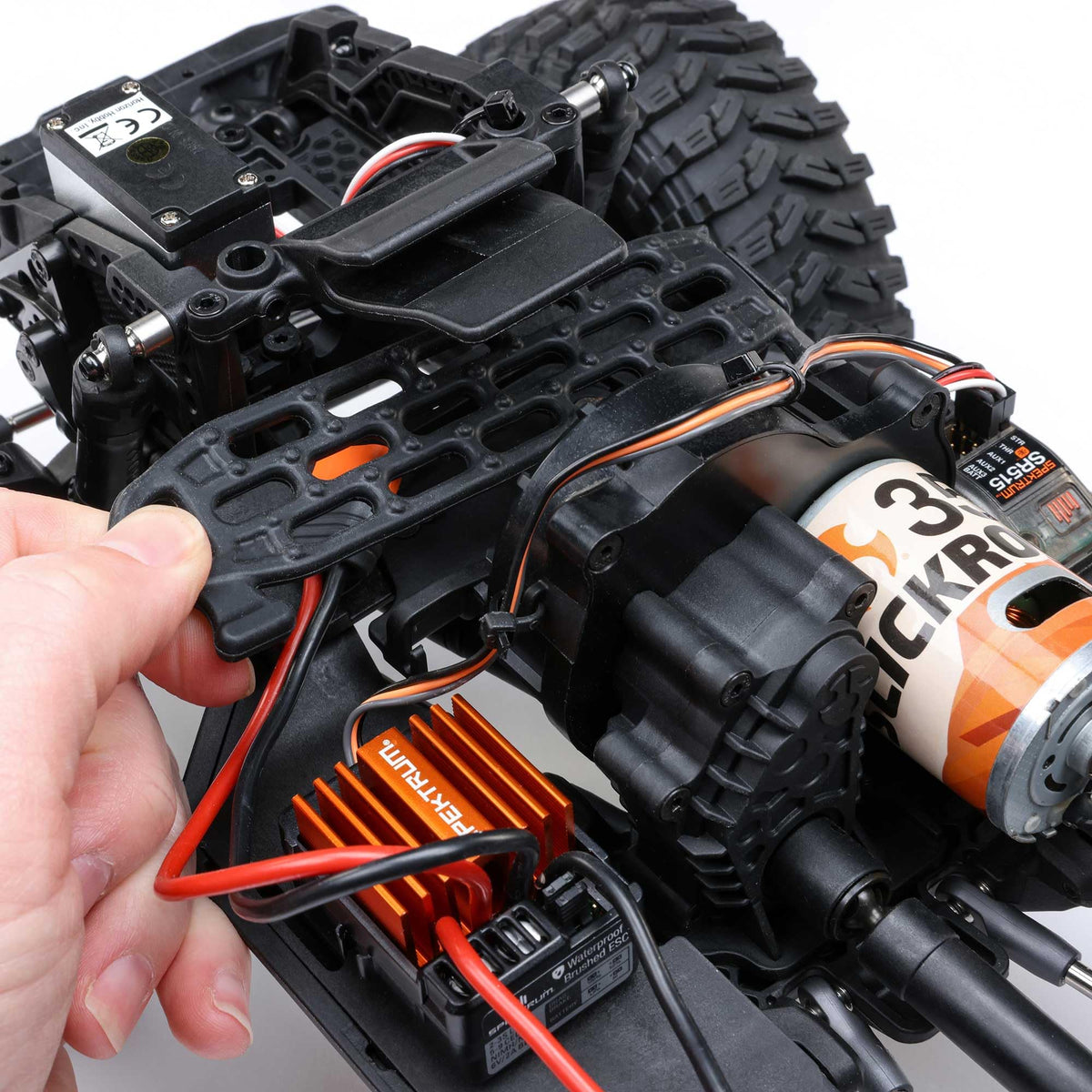 Axial SCX10III gold finish captures attention during rock crawling sessions.