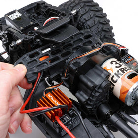 Axial SCX10III gold finish captures attention during rock crawling sessions.