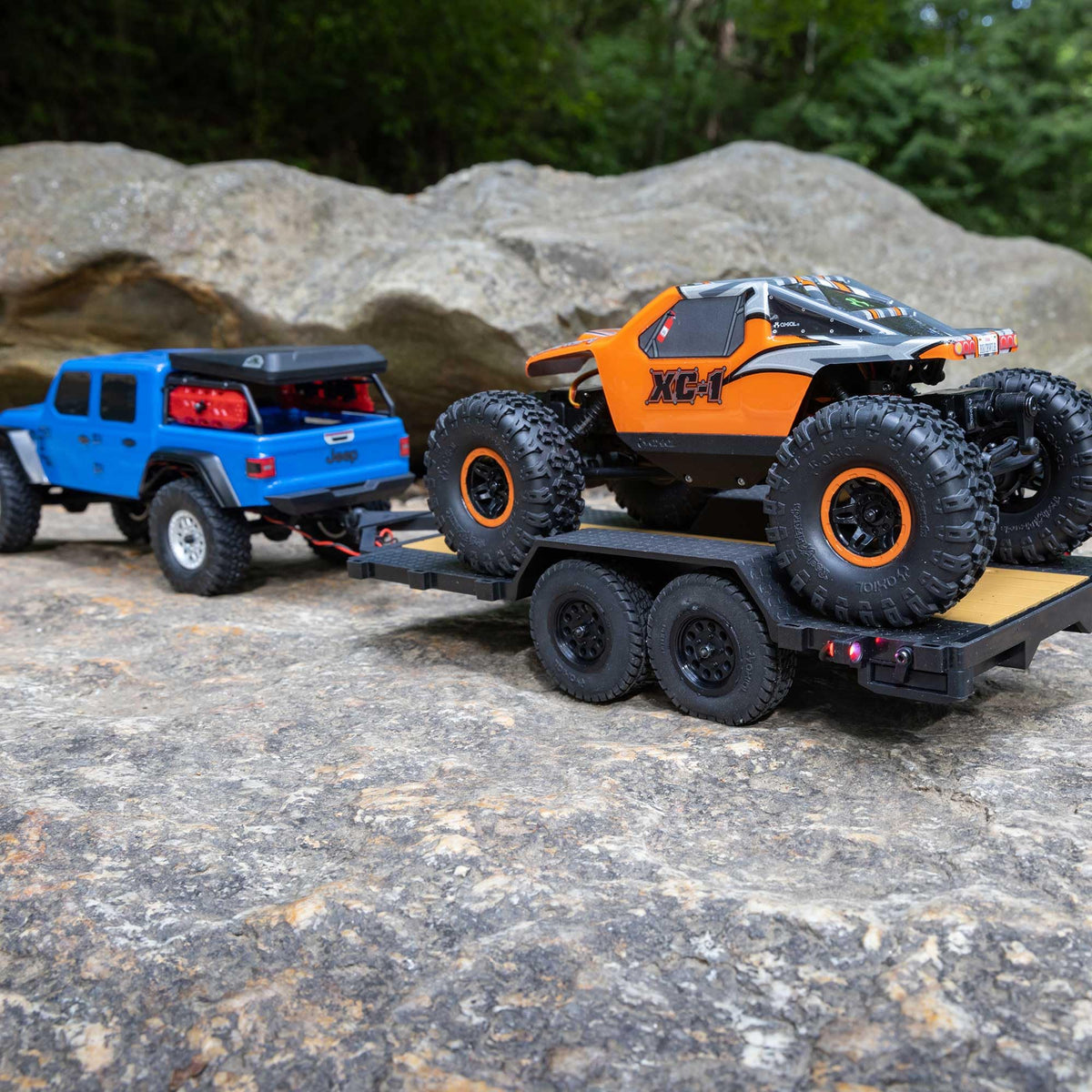 Axial SCX24 flat bed trailer ready to use for display setups.
