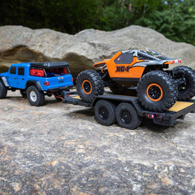 Axial SCX24 flat bed trailer ready to use for display setups.