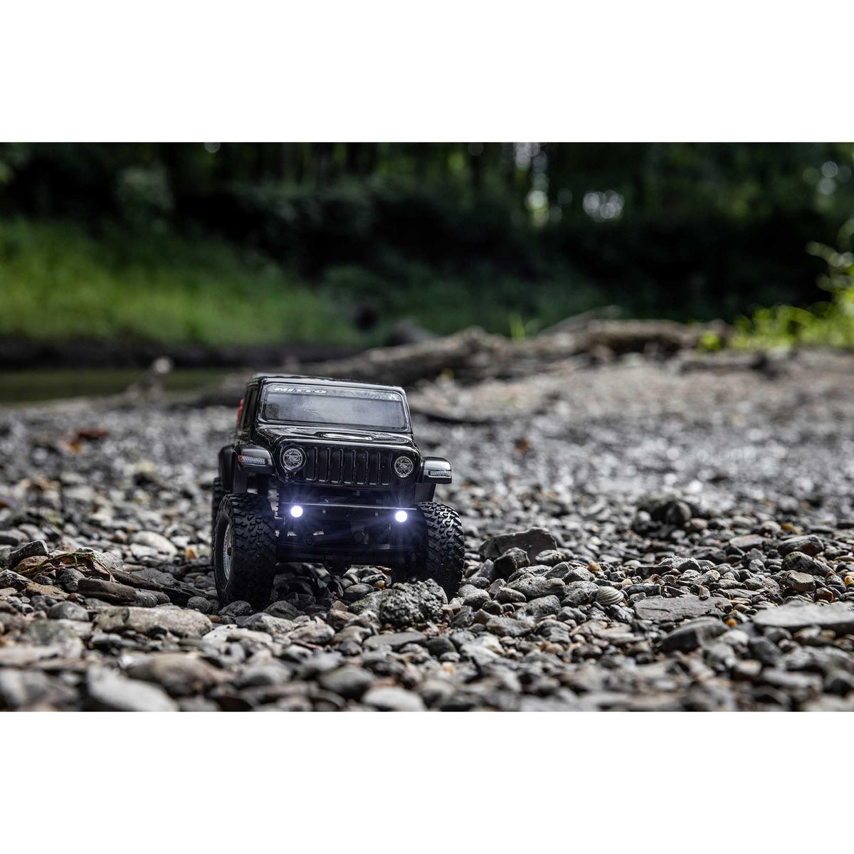 Axial SCX24 metal chassis provides rugged durability on trails.