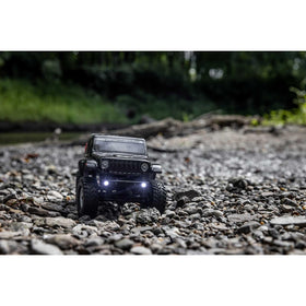 Axial SCX24 metal chassis provides rugged durability on trails.