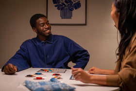 Azul board game family night setup with four players around the table