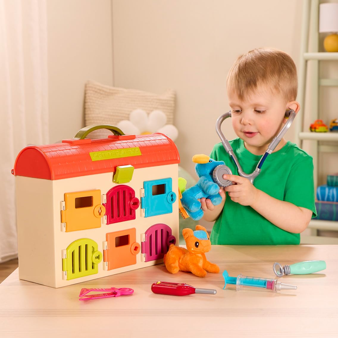 B. toys Critter Clinic thermometer and tweezers for fine motor practice.
