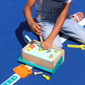 B. toys Fix-n-Play Kit drill in action for imaginative building sessions.