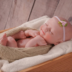 BABESIDE clothes and swaddle set, versatile posing for nurturing play.