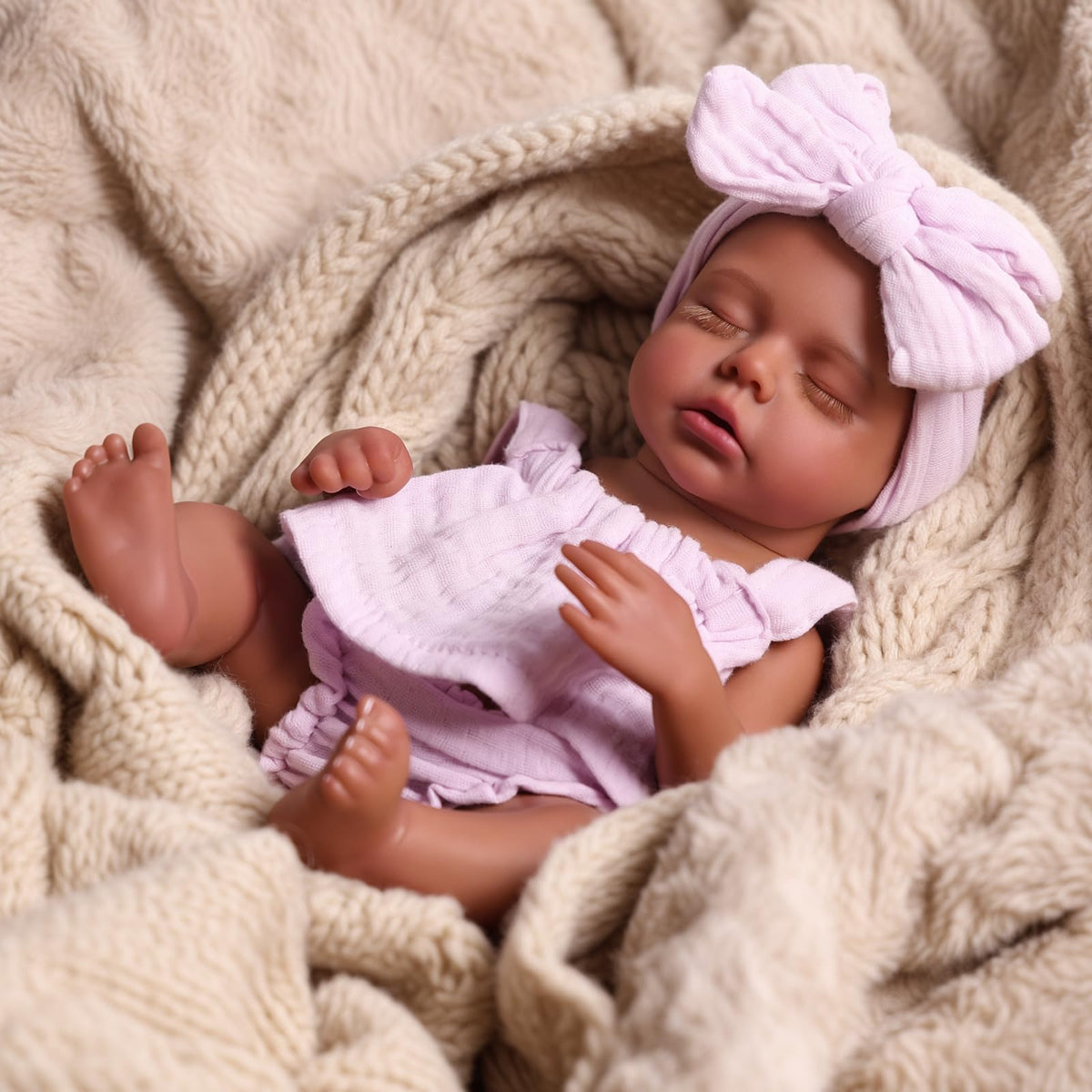 Babeside Daisy 12-inch doll with feeding bottle for nurturing play scenes.