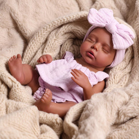Babeside Daisy 12-inch doll with feeding bottle for nurturing play scenes.