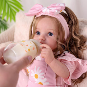 BABESIDE Reborn doll poses for bedtime cuddles and cozy stories.