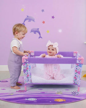 BABESIDE purple doll crib with animal graphic for imaginative play.