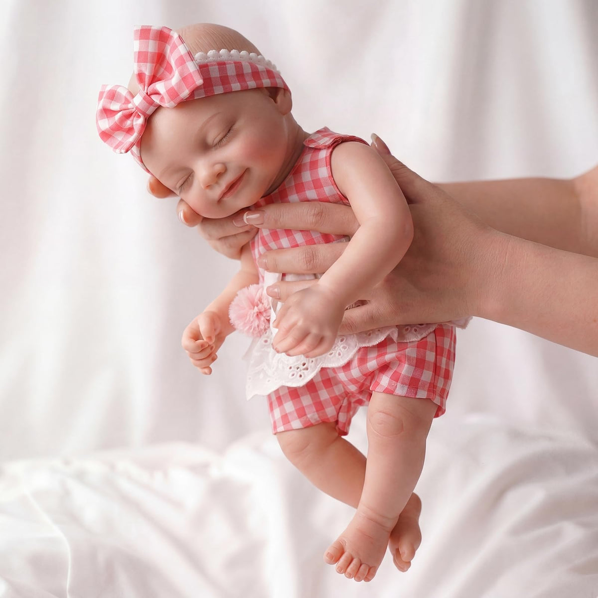 BABESIDE sleeping-face silicone baby doll for lifelike cuddling and imaginative play