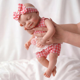 BABESIDE sleeping-face silicone baby doll for lifelike cuddling and imaginative play