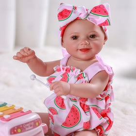 BABESIDE Sunny doll in hand demonstrates kid-friendly, portable size for travel