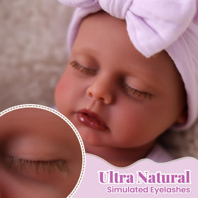 BABESIDE weighted newborn doll shows handheld heft for realistic nurturing moments.