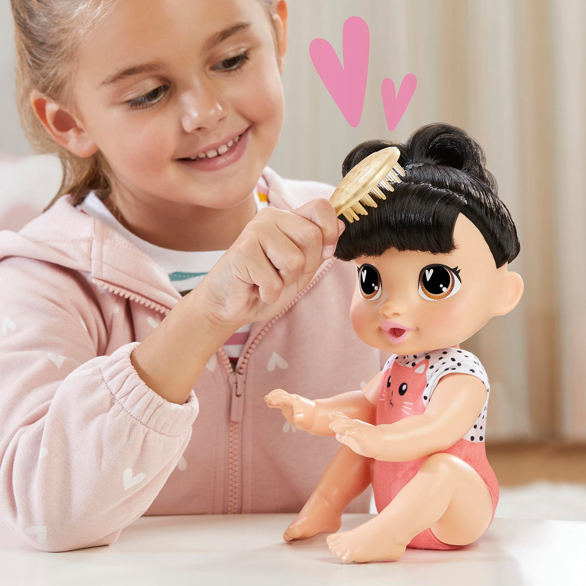 Baby Alive Katie Kat removable onesie for quick outfit changes.