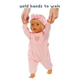 BABY born Olivia sits and kicks, engaging attention and gentle movement.