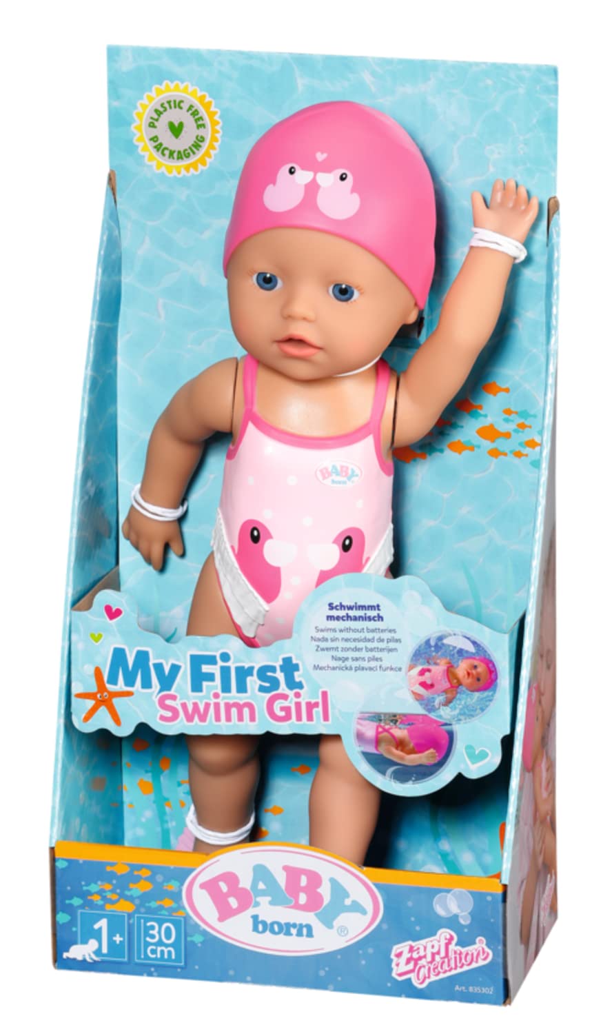 Baby Born swim girl sits by the pool edge watching parents.