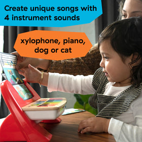 Three color-coded music cards guide melodic play alongside Baby Einstein Cal's First Melodies