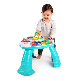 Baby Einstein Discovering Music Table drum promotes rhythmic play and hand-eye coordination.