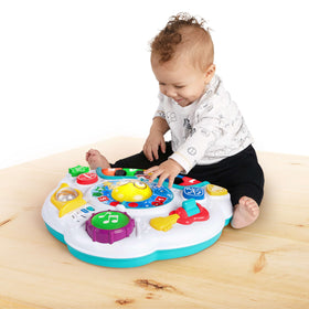 Baby Einstein Discovering Music Table guitar encourages pretend jam sessions and fine motor practice.