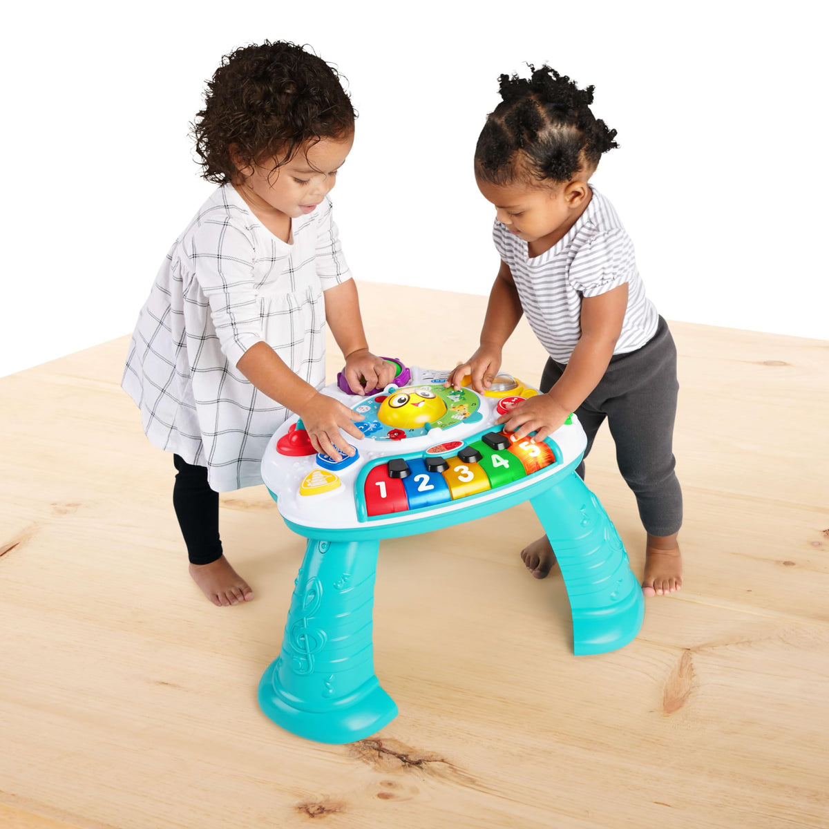 Baby Einstein Discovering Music Table multilingual switch enables English, Spanish, and French exploration.