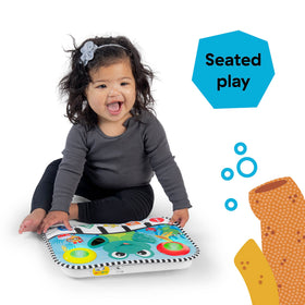 Baby Einstein kick buttons illuminate lights and sounds for cause-and-effect learning.