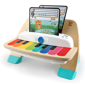The Baby Einstein Magic Touch Piano wooden toy close-up with color-coded notes for learning