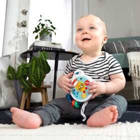 Baby Einstein Small Symphony tambourine close-up shows gentle jingles for tiny ears