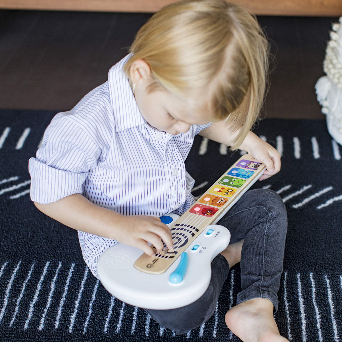 Baby Einstein Strum Along Songs guitar side view shows portable wooden design for on the go play
