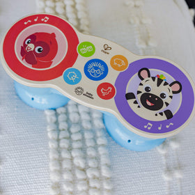Baby Einstein Upbeat Tunes Magic Touch Drum toddler-playing scene shows engagement.