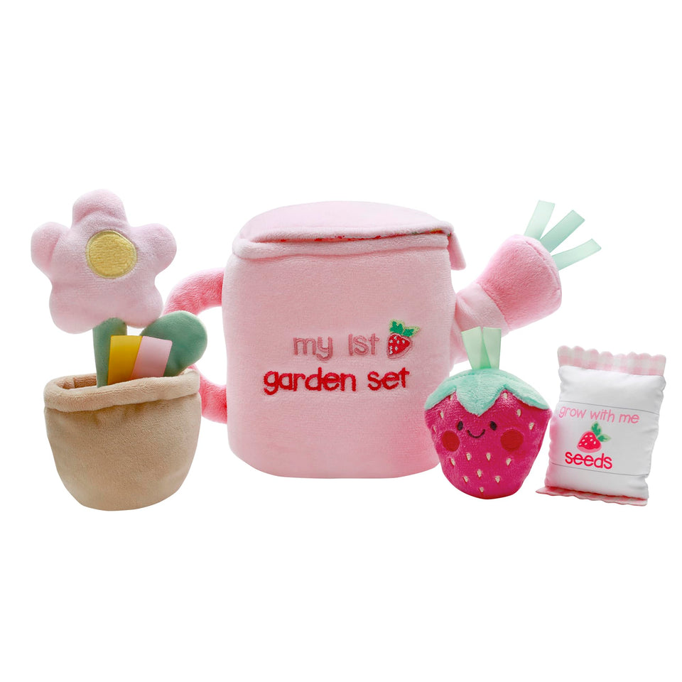 Baby Starters plush watering can invites tactile exploration during tummy time and pretend garden play.