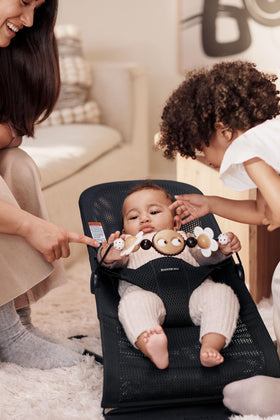 BabyBjörn toy bar with three positions supports growing babies' play.